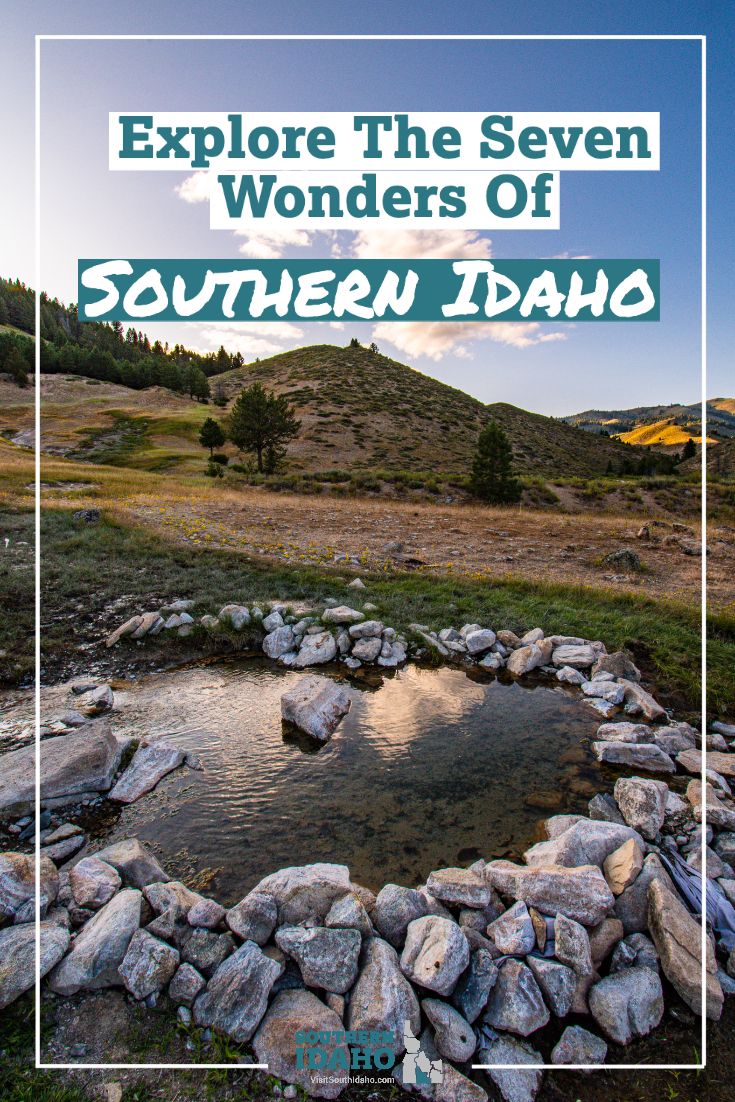 a small pond surrounded by rocks with the words explore the seven wonders of southern idaho