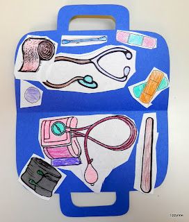 a blue suitcase with various items cut out on the front and side, sitting on a white surface