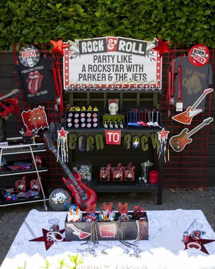 a rock and roll themed birthday party with guitars, cake pops, candy bars and more