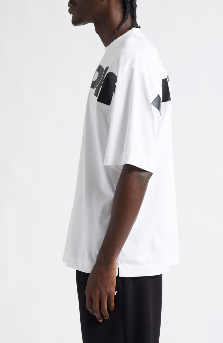 A contrast logo in an upsized typeface wraps around this casual cotton T-shirt designed in a comfortably oversized silhouette. Crewneck Elbow-length sleeves Dropped shoulders 100% cotton Machine wash, line dry Made in Portugal Designer Clothing Black Owned/Founded White Relaxed Fit T-shirt With Logo, White Logo Detail Short Sleeve Tops, White Short Sleeve Tops With Logo Detail, White Short Sleeve Top With Logo Detail, Modern Streetwear Tops With Logo Detail, Modern Tops With Logo Detail For Streetwear, White T-shirt With Logo Detail And Relaxed Fit, White T-shirt With Logo Detail, White Relaxed Fit T-shirt With Logo Detail