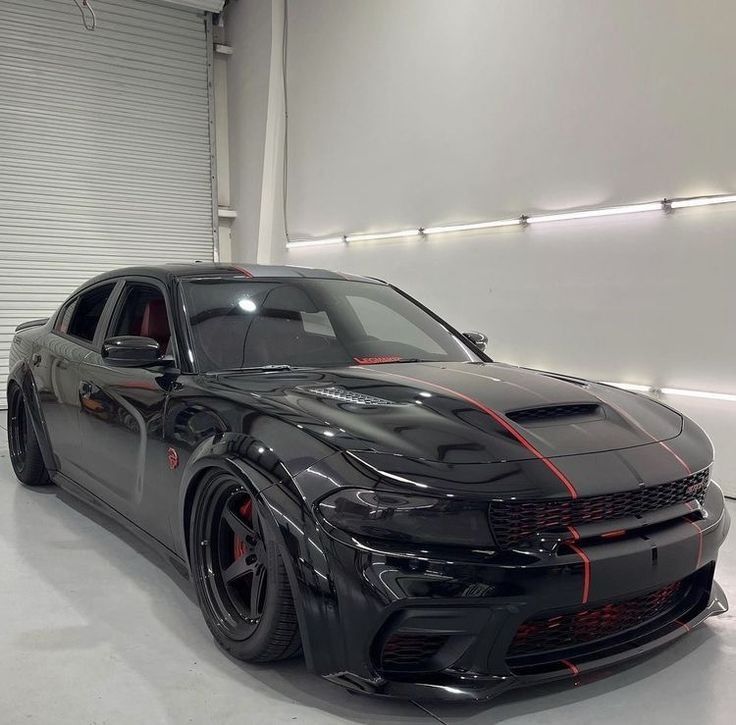 a black sports car parked in a garage