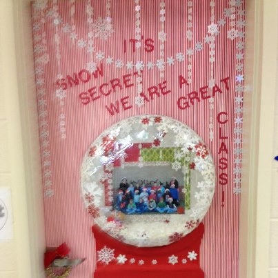 a door decorated with snowflakes and an ornament that says it's secret we are great class