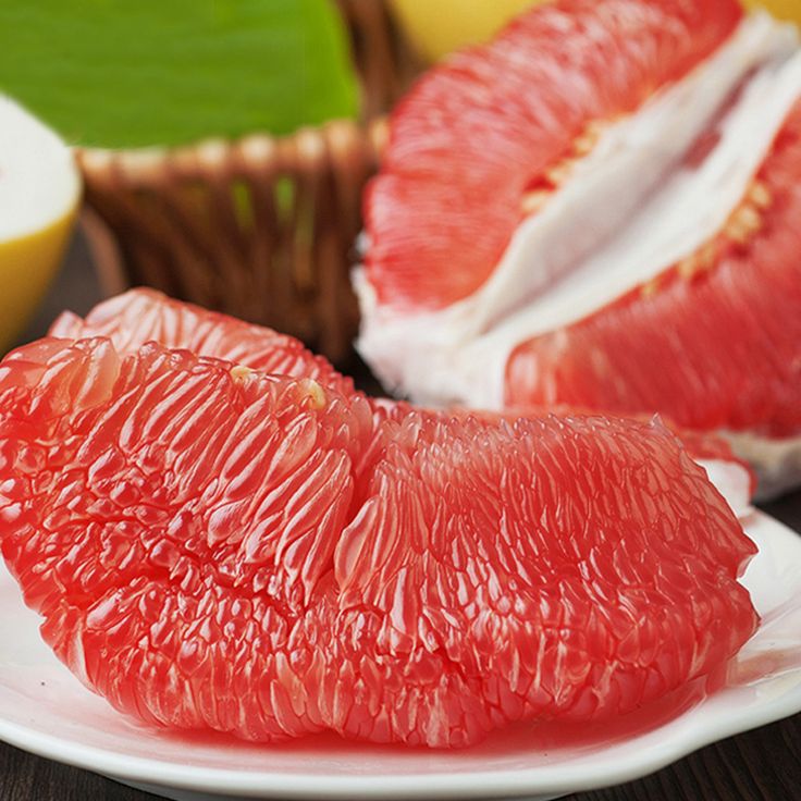 the grapefruit is cut in half and ready to be eaten