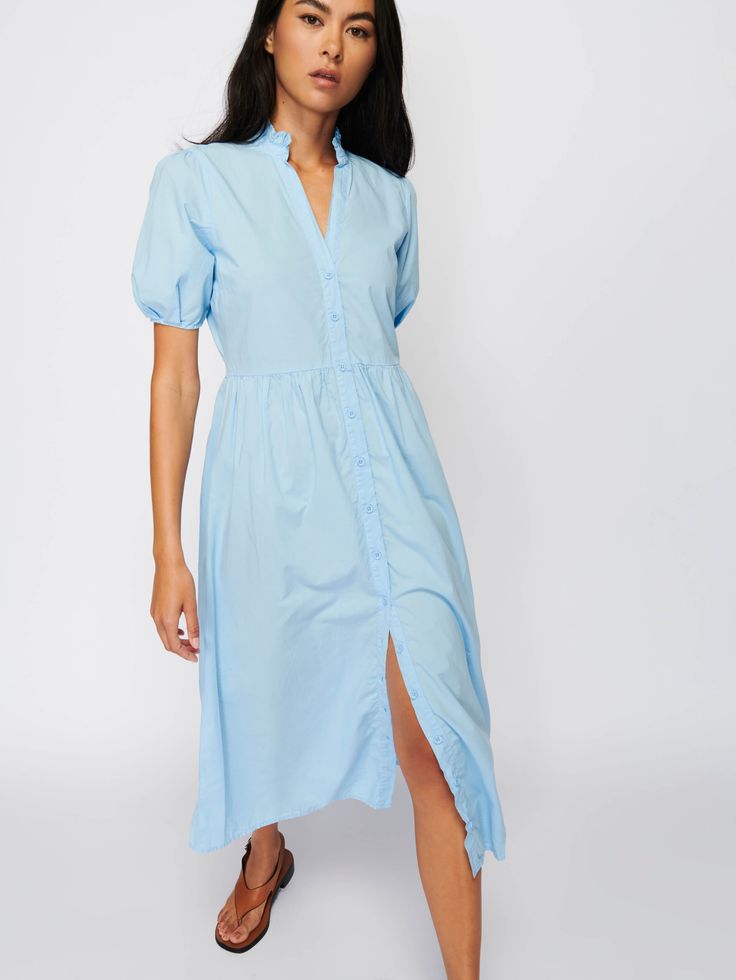 One and done (and out the door). Exaggerated short sleeves, ruffle detail around the notched neckline, a slightly gathered waist, and a breezy silhouette. (This one comes in Shirting.) | Liliya Dress in Shirting | Ethical Essentials Cotton Dresses With Gathered Waist And Short Sleeves, Spring Short Sleeve Dress For Daywear, Relaxed Fit Short Sleeve Dress For Spring Daywear, Spring Short Sleeve Dresses With Gathered Waist, Spring Dresses With Gathered Waist And Short Sleeves, Summer Puff Sleeve Shirt Dress With Buttons, Puff Sleeve Button Shirt Dress For Summer, Fitted Short Sleeve Midi Dress With Placket, Fitted Midi Dress With Placket And Short Sleeves