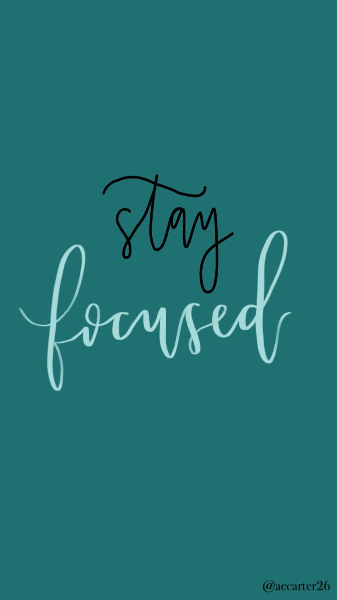 the words stay focused written in black ink on a teal green background with white lettering