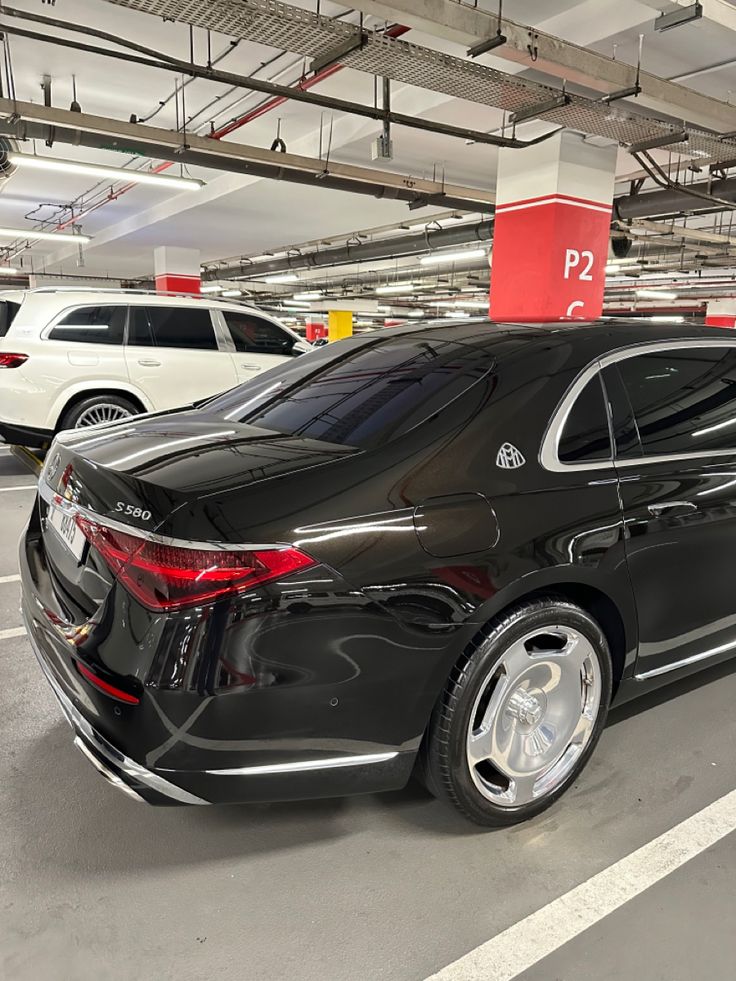 a black car parked in a parking garage