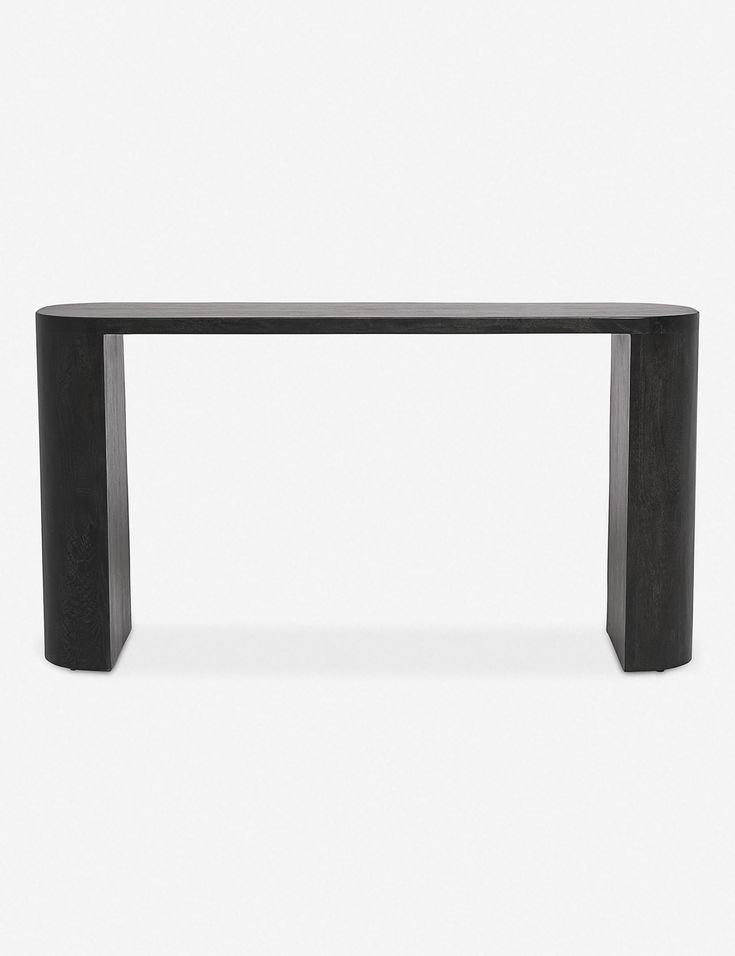 a black table sitting on top of a white floor