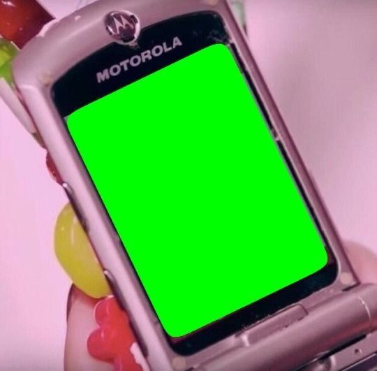 a person holding a cell phone with a green screen in their hand and gums around them