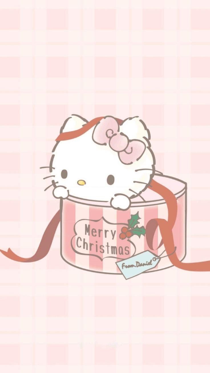 a hello kitty christmas card with a bow on it's head and the caption merry christmas