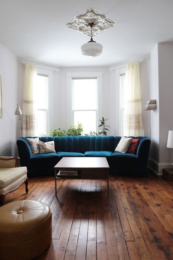 a living room filled with furniture and wooden floors