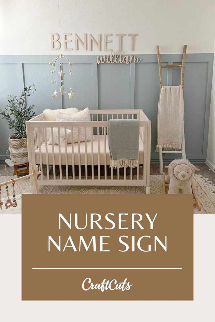 the nursery name sign is in front of a baby's crib