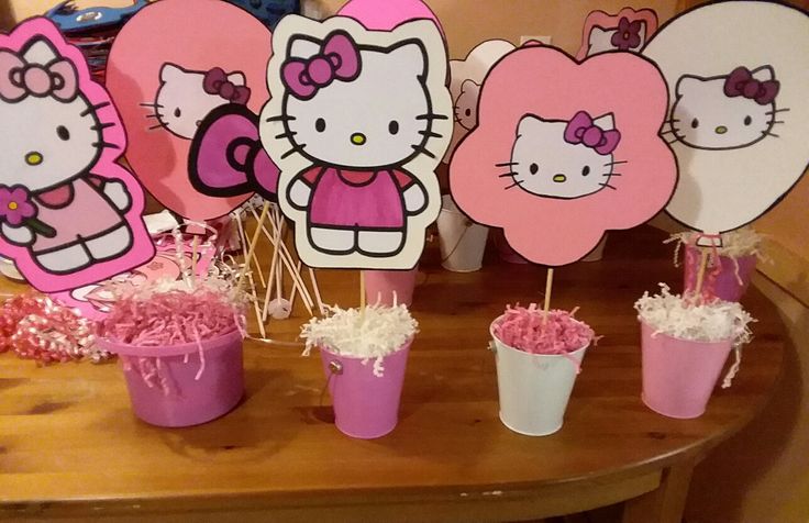 hello kitty party decorations on a table