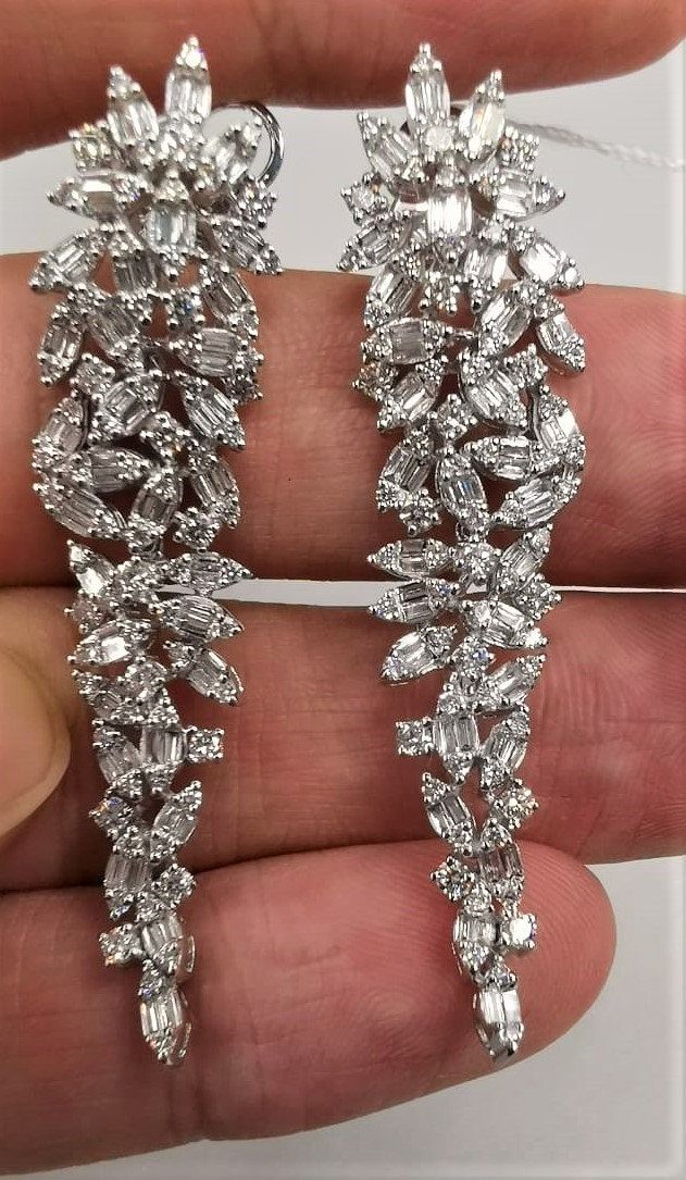 LAST CALL, LAST CHANCE LIQUIDATION SALE The Following Items we are offering is a Rare Important Spectacular and Brilliant 18KT Gold Large Gorgeous Fancy Cascading Diamond Drop Draping Earrings. Earrings consists of Rare Fine Magnificent Fancy Glittering Diamonds. T.C.W. with approx 3.75CTS of Fancy Baguette and Trillion Cut Diamonds These Magnificent Earrings are a Rare Sample Pair and from a Private Manufacturer that sold to Important 5 Star Hotel and Fine Jewelry Stores and come NWT $18,559 and with a Gemological Certificate! A Pair of Exquisite Masterpieces!! We are in the Process of Liquidation and selling at BELOW DEALERS COST in order to stay in business WE PACK, SHIP, AND INSURE WORLDWIDE COME VISIT US AT:   ROYALE GALLERIES INC. 318 EAST 59TH STREET NEW YORK, NY 10022 212-308-0200 Mint Green Earrings, Rare Jewelry, 5 Star Hotel, Heavy Earrings, Liquidation Sale, Greek Jewelry, Link Earrings, Expensive Jewelry, Star Hotel