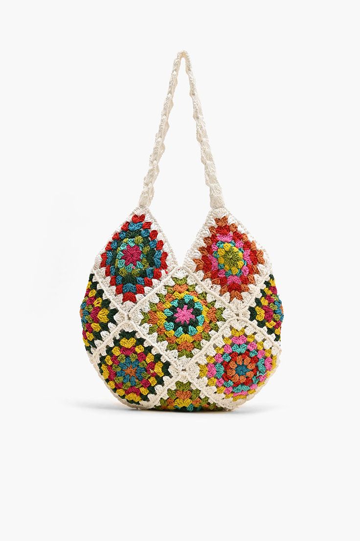 Shoulder bag Crochet Top Handle Colorful floral patchwork from front to back Magnetic button closure Lined interiors with zip pocket Size: 13.5" x 12.5" Embrace your free-spirited style and make a statement with this bohemian-inspired bag that's as practical as it is stylish. The Slouchy Crochet Shoulder Bag is a bohemian-inspired accessory that effortlessly combines style and functionality. Crafted with care and attention to detail, this shoulder bag is perfect for those who appreciate unique a Multicolor Rectangular Hobo Bag With Braided Handles, Multicolor Hobo Bag With Braided Handles For Beach, Multicolor Square Shoulder Bag With Braided Handles, Multicolor Woven Hobo Tote Bag, Multicolor Patchwork Hobo Bag For Daily Use, Bohemian Hobo Bag With Braided Handles For Spring, Multicolor Woven Hobo Bag, Summer Multicolor Hobo Tote Bag, Casual Multicolor Hobo Bag With Braided Handles