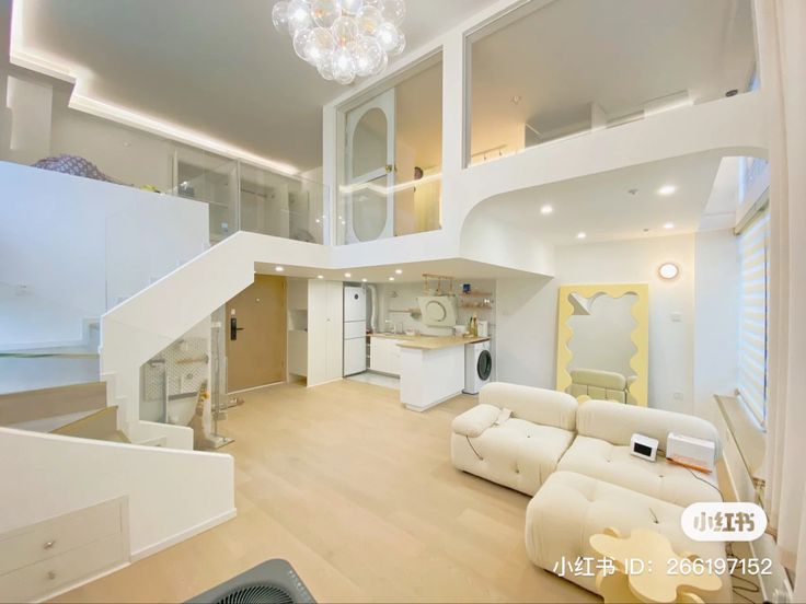 a living room filled with furniture and a staircase