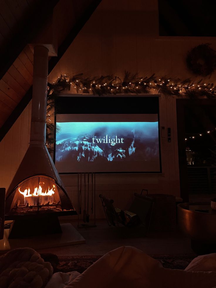 a living room filled with furniture and a fire place in front of a flat screen tv