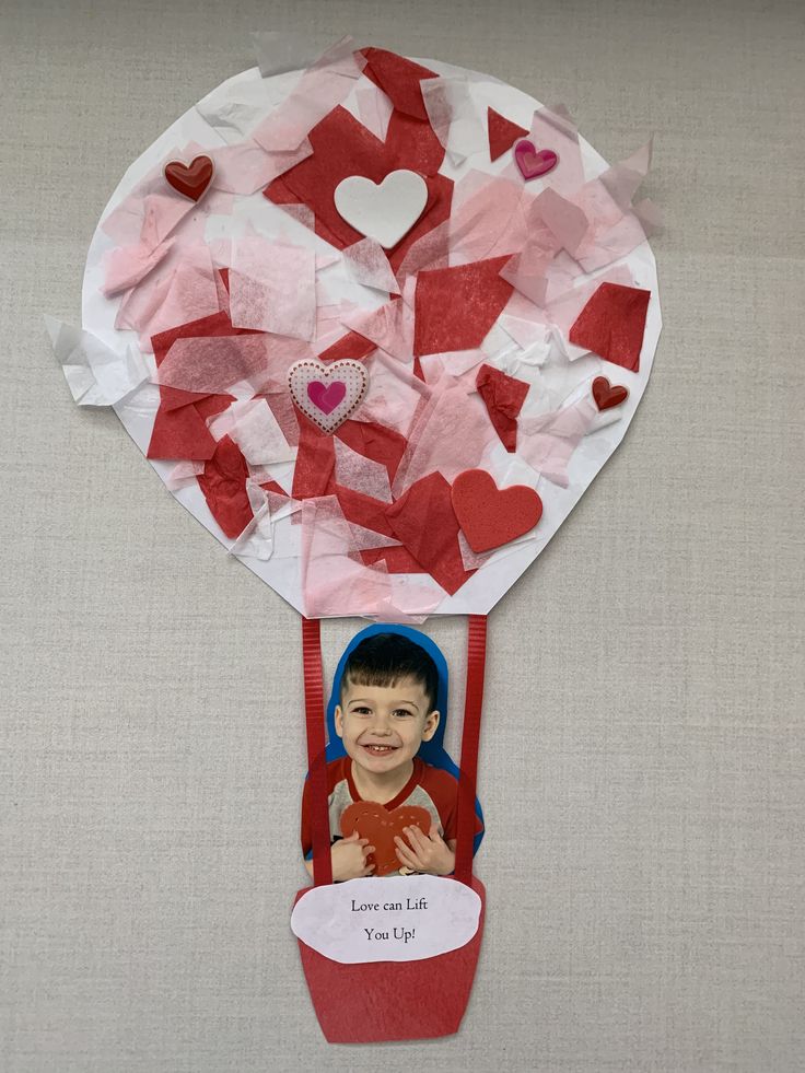 a child's valentines day card with a hot air balloon made out of tissue paper