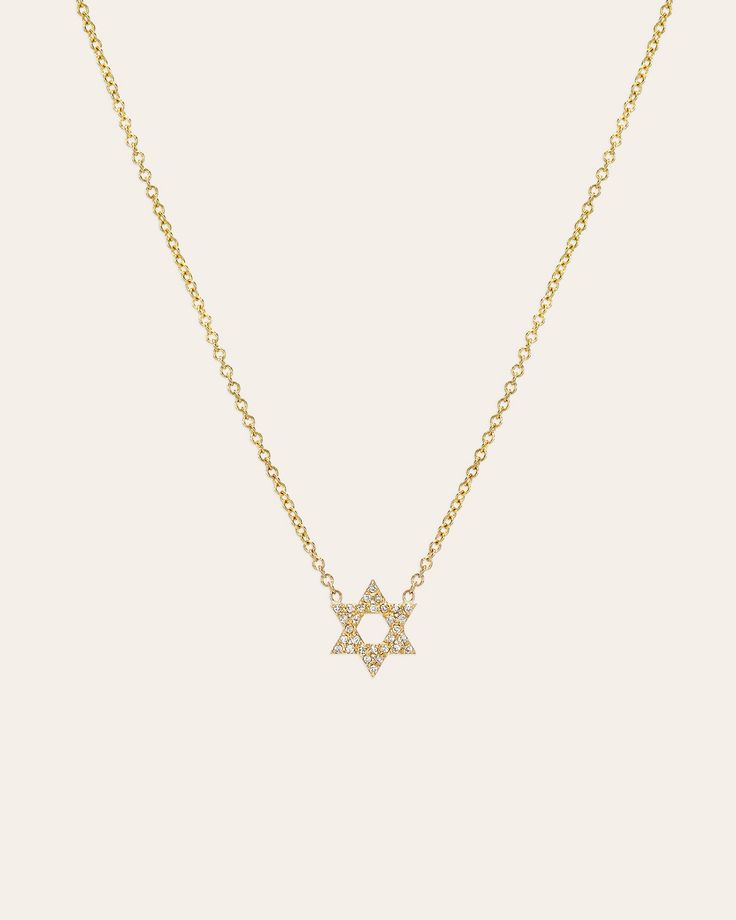 Show your strong connection to your Jewish faith with this exquisite Diamond Open Star of David Necklace. Featuring 30 genuine round-cut diamonds, this delicate piece will add a touch of elegance to any outfit. Made in L.A. Size of Star: Approx. 9mm Diamond Carat Weight: Approx. .07 cttw Total Weight: Approx. 1.5 grams Ships in 4-8 business days Rush order ships in 3-6 business days Comes carefully packaged in a branded Zoe Lev jewelry box. Elegant Star-shaped White Gold Diamond Necklace, Elegant Star Shaped White Gold Diamond Necklace, Elegant White Gold Star Diamond Necklace, Diamond Necklace With Star Charm, Elegant Star Diamond Necklace With Diamond Accents, Elegant Star-shaped Jewelry With Single Diamond, Elegant Star-shaped Diamond Necklace With Accents, Elegant Star-shaped Single Diamond Jewelry, Elegant Diamond Necklace With Star Of David Charm