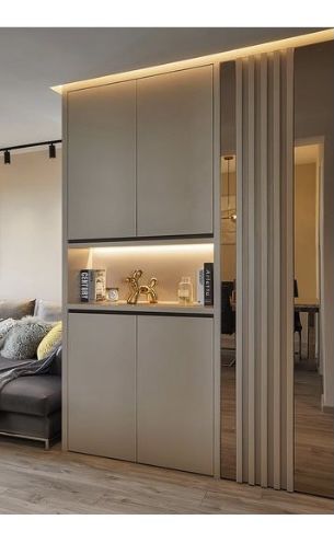 a living room filled with furniture next to a kitchen and dining room table in front of a sliding glass door