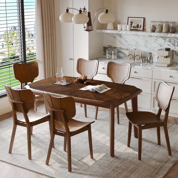 a dining room table with four chairs and a rug on the floor in front of it