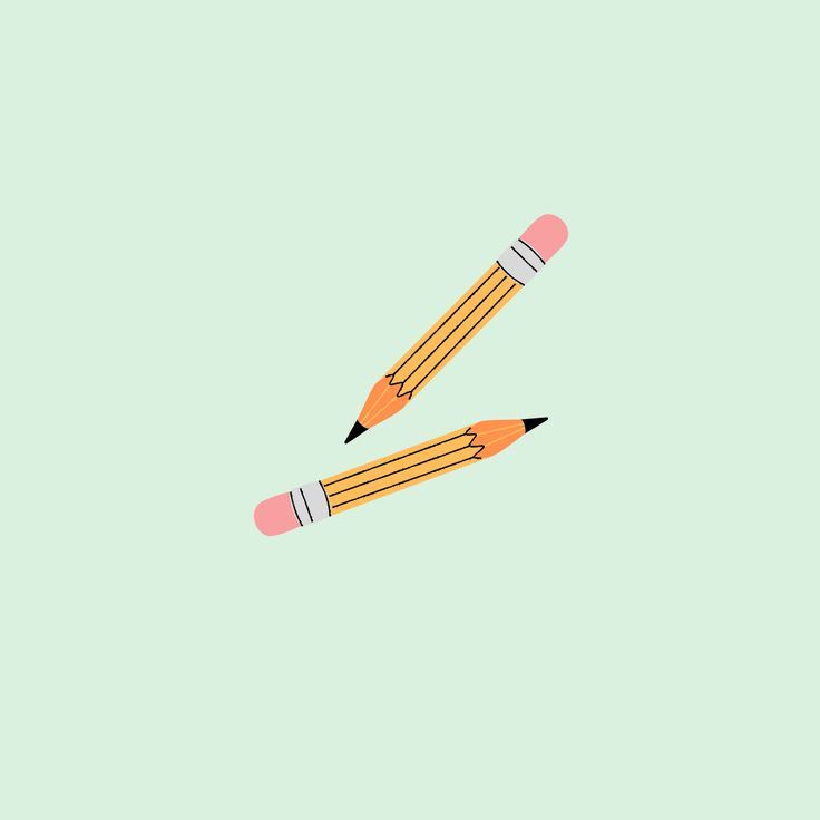 two pencils sitting on top of each other in front of a light green background