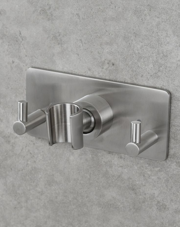 a close up of a wall mounted shower faucet