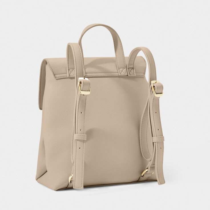 The Demi Backpack is the perfect companion for your daily adventures. Its compact size makes it ideal for travel, while its lightweight design ensures comfort and convenience. Made from premium soft vegan leather, this backpack is both stylish and sustainable. Details: Dimensions: 10 5/8" x 9 1/16" x 4 1/2" By Katie Loxton London Backpack Katie Loxton Beige Backpack For On-the-go, Classic Backpack With Adjustable Strap For On-the-go, Classic Everyday Backpack With Adjustable Strap, Casual Backpack With Detachable Strap For On-the-go, Functional Everyday Backpack With Detachable Strap, Classic Beige Backpack With Detachable Strap, Versatile Everyday Backpack With Adjustable Strap, Trendy Beige Travel Backpack, Versatile Backpack With Adjustable Strap For Everyday