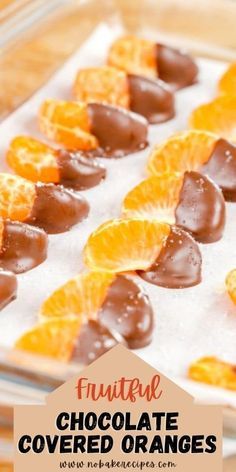 chocolate covered oranges are arranged in the shape of hearts on top of an ice tray