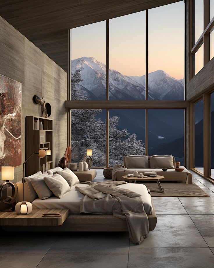 a modern bedroom with large windows overlooking the mountains