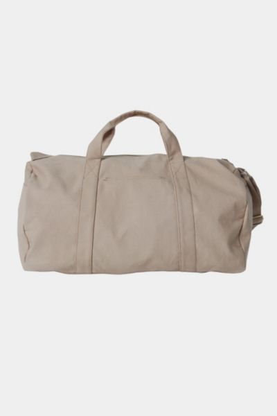 Nothing beats the simplicity and functionality of a good duffel bag—except maybe a Certified Organic Cotton duffel bag made with the good of the environment and people in mind! Durable and versatile, the Bumi Duffel Bag is sustainably and ethically made with 14-oz heavy duty Fairtrade organic cotton canvas. The perfect size for a spontaneous weekend getaway or when you need a little more room to haul daily needed gear for work or athletics, the Bumi Duffel has an adjustable shoulder strap, an ou Practical Everyday Cotton Duffle Bag, Practical Cotton Duffle Bag For Everyday, Practical Cotton Duffle Bag, Beige Large Capacity Gym Bag For Everyday Use, Large Capacity Beige Gym Bag For Everyday Use, Rectangular Beige Gym Bag For Everyday Use, Rectangular Beige Gym Bag For Everyday, Everyday Beige Rectangular Gym Bag, Rectangular Beige Gym Bag