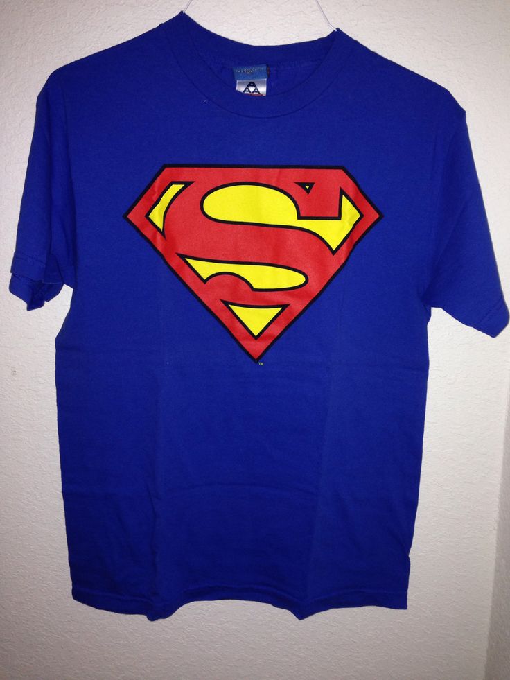 a blue t - shirt with a superman logo on it