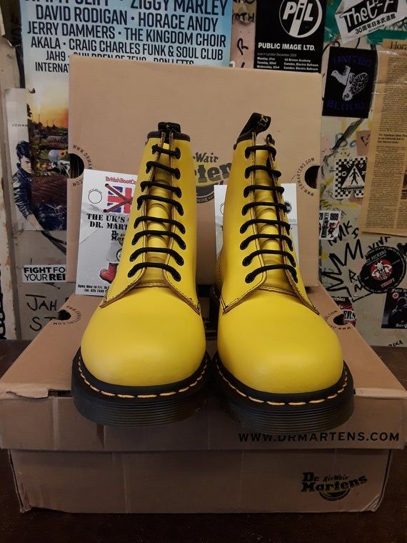 Dr Martens 1B89 in yellow with classic black Dr Martens logo down the outside of the boot. This pair was very popular during the mid 2000s and are now very rare and highly sought after. The boots feature the iconic yellow and black colour way, yellow stitching and famous Dr Martens barrelled sole unit.Available in Size 3 and 7 UK Classic Winter Boots For Streetwear, Classic High-top Boots For Streetwear, Classic Yellow Boots With Round Toe, Classic Yellow Round Toe Boots, Yellow Leather Waterproof Boots For Winter, Yellow High-top Boots For Streetwear, Casual Yellow Boots With Reinforced Toe, Yellow Waterproof Boots With Reinforced Round Toe, Yellow Winter Boots With Reinforced Toe