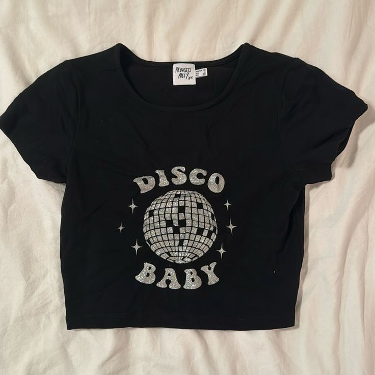 Princess Polly Black Baby Tee With Graphic | Black With Silver Graphic | Size 6 | Never Worn Graphic Baby Tee, Baby Crop Top, Baby Graphic Tees, Crop Top Casual, Black Baby, Baby Tee, Princess Polly, Infant Tees, Crop Tops Women