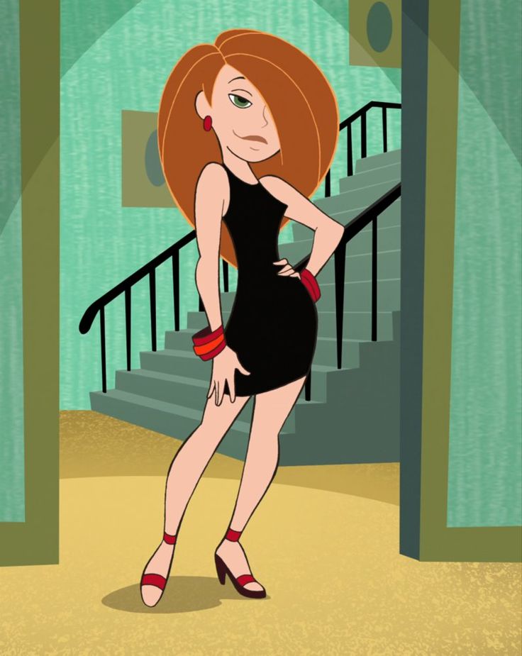 a woman in a black dress standing next to a stair case with her hands on her hips