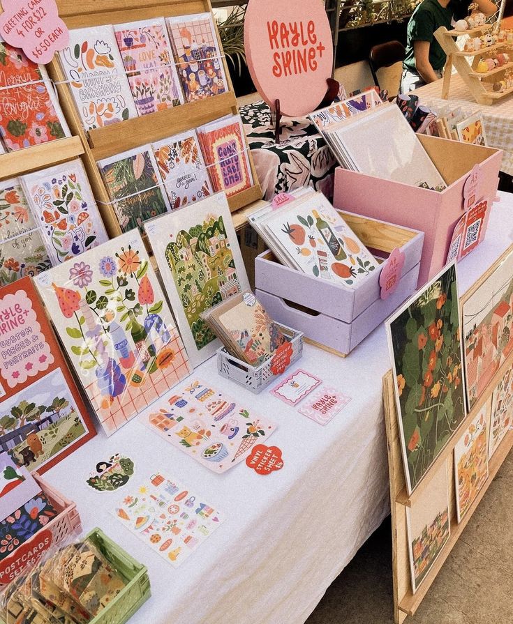 there are many cards on the table at this craft fair, including one for sale