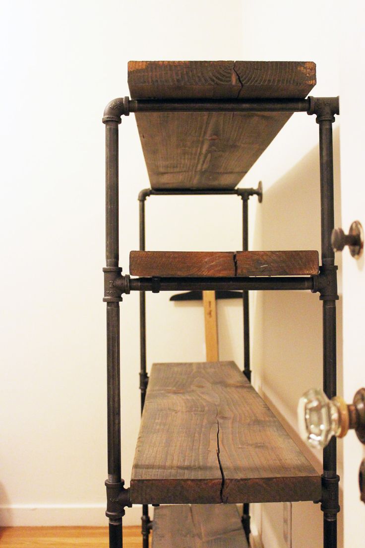 a wooden shelf with two shelves on it and the words man cave written above it