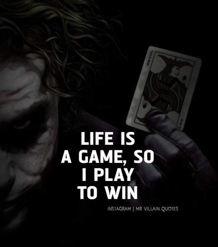 a joker holding up a card with the words life is a game, so i play to win