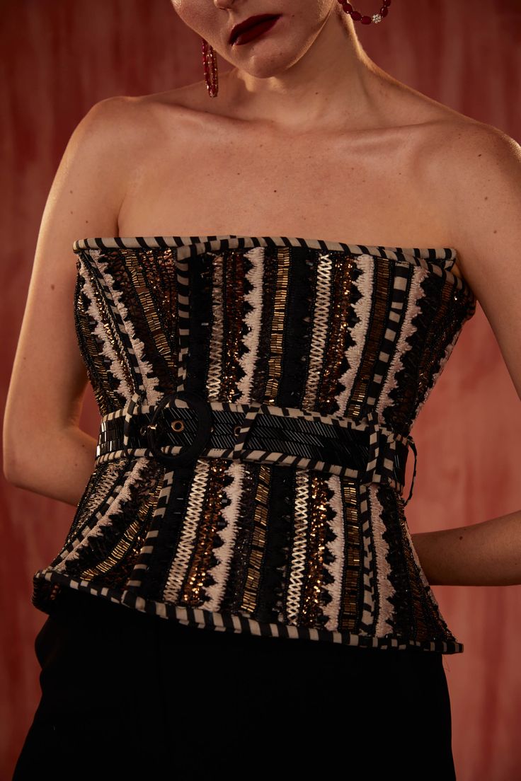 Embrace opulent elegance with this byzantine embroidered corset with belt. Adorned with intricate byzantine-inspired embroidery, this corset cinched with a belt exudes regal sophistication. Elevate your ensemble with this statement piece that effortlessly combines history and haute couture. Elegant Party Corset With Belt, Elegant Strapless Corset Belt For Evening, Fitted Party Corset With Belt, Luxury Overbust Corset For Evening, Luxury Overbust Corset With Boned Bodice, Luxury Corset Belt, Elegant Fitted Corset With Belt, Luxury Fitted Corset Belt, Luxury Strapless Corset Dress