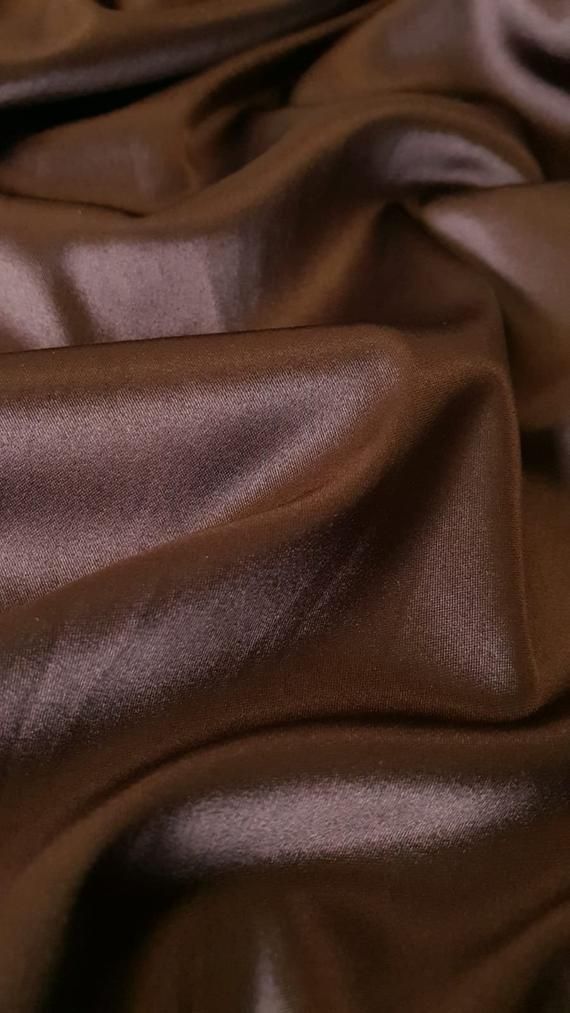 a close up view of a shiny brown fabric