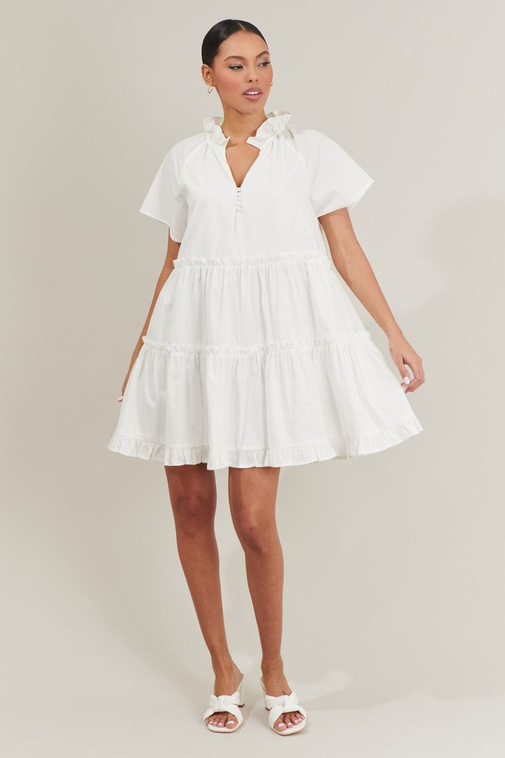 Weather you’re looking for something casual or cute, the Pallas Poplin Tiered Mini Dress will suit you perfectly! This mini dress has ruffle tiers all along a loose fit style. A split neckline with a self-tie neck makes it easy to style. Add on your sandals or heels to this cute dress! - Tiered- Ruffles- V-neck- Tie neck- Comes in 2 colorsSize + Fit - Model is 5'8" and wearing size XS- Measurements taken from size S - Chest: 20 3/4"- Length: 35" Fabric Self: 100% Cotton, Lining: 97% Polyester, 3 White V-neck Tiered Casual Dress, White Ruffle Hem Tiered Dress For Vacation, White Tiered Dress With Ruffle Hem For Vacation, White Tiered Cotton Ruffle Dress, White Tiered Skirt Mini Dress For Day Out, White Tiered Dress With Ruffle Hem, White Tiered Dress With Layered Hem, Casual Tiered Ruffle Dress For Daywear, White Mini Length Tiered Dress With Ruffles