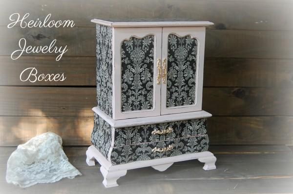 a white and black cabinet sitting on top of a wooden floor next to a rock