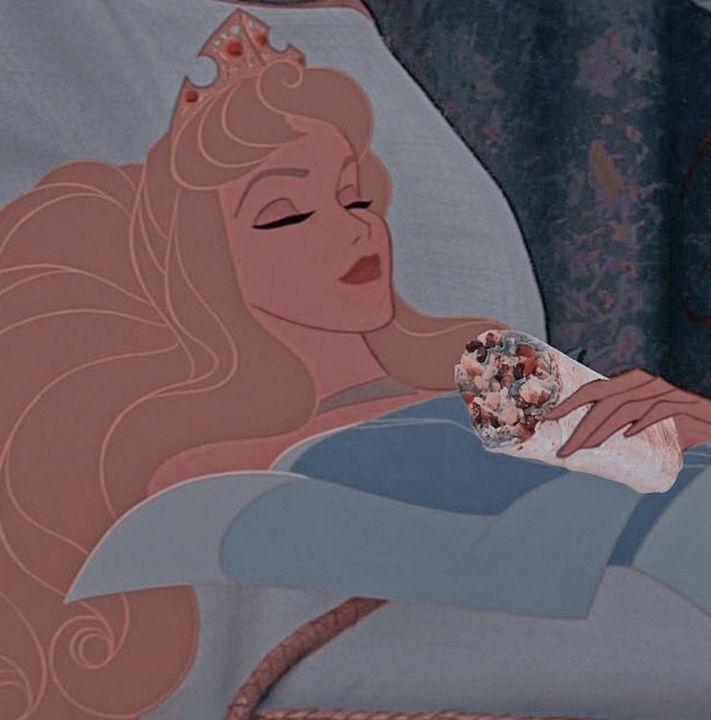 the sleeping princess is holding a donut in her hand