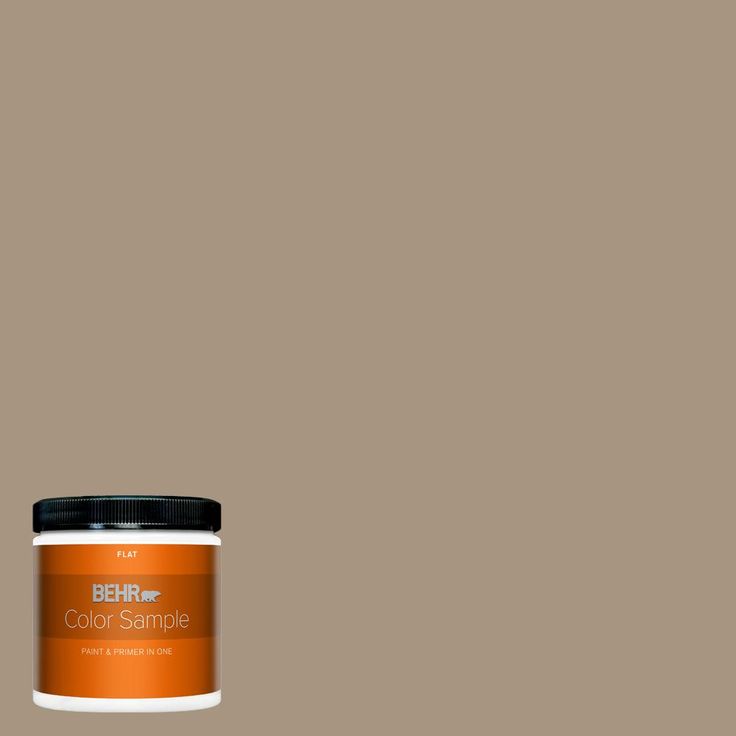 the behr paint color is shown in an orange hue, and it has a black lid