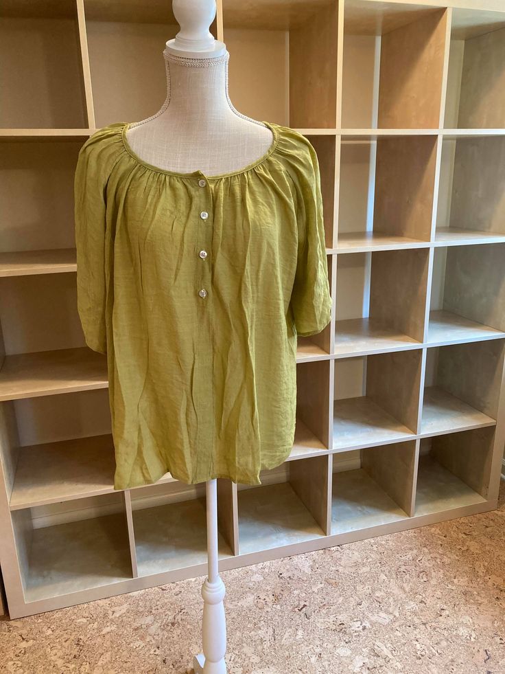 Spring has never looked brighter with this button blouse! This 3/4 sleeve top is perfect for any layering outfit or just standing on its own with your favorite denim jeans and sporty shoes. The elbow length short sleeves and gathered neckline details add to the unique chic other blouses can't offer you. Tuck half the front for a trendy fun look in the sun. MATERIAL: 100% Poly Blend MEASUREMENTS: Blouse Length is 25"-27"in Relaxed Fit Blouse With Button Closure For Casual Wear, Casual Short Sleeve Top For Summer Daywear, Casual Half Sleeve Blouse With Button Closure, Half Sleeve Blouse For Daywear, Spring, Short Sleeve Blouse With Button Closure For Casual Gatherings, Half Sleeve Tops For Spring Day Out, Spring Short Sleeve Top With Rolled Sleeves, Spring Tops With Rolled Sleeves, Casual Linen Peasant Top For Summer