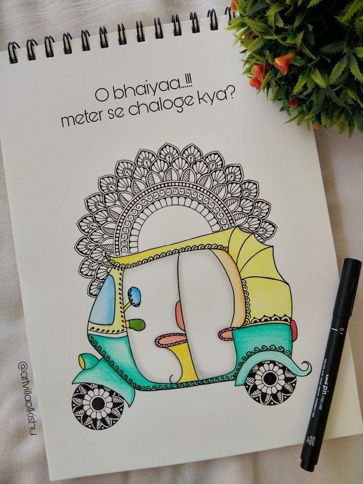 a coloring book with an image of a scooter on the cover and a pen next to it