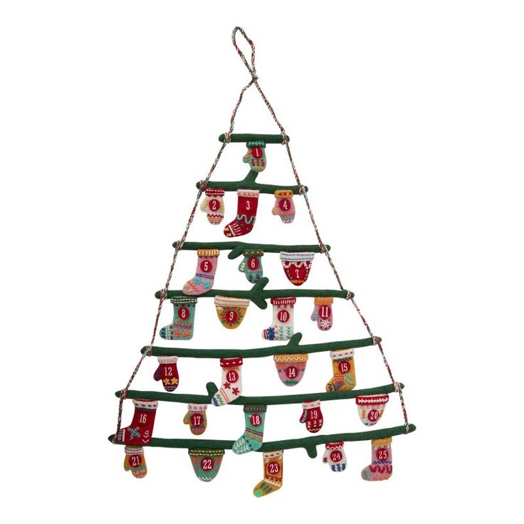 a christmas tree with stockings hanging from it's sides and socks on the bottom