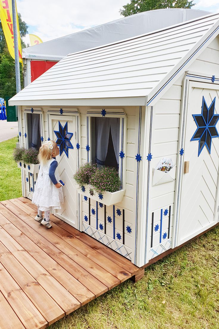 The girl looks in through the window of the wooden playhouse Cornflower by WholeWoodPlayhouses Playhouse Ideas Outdoor, Kids Playhouse Ideas, Playhouse Door, Outdoor Playhouse Plans, Boys Playhouse, Outdoor Playhouses, Plastic Playhouse, Playhouse Makeover, Kids Playhouse Outdoors