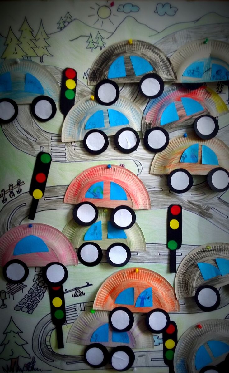 some paper plates with cars on them and traffic lights