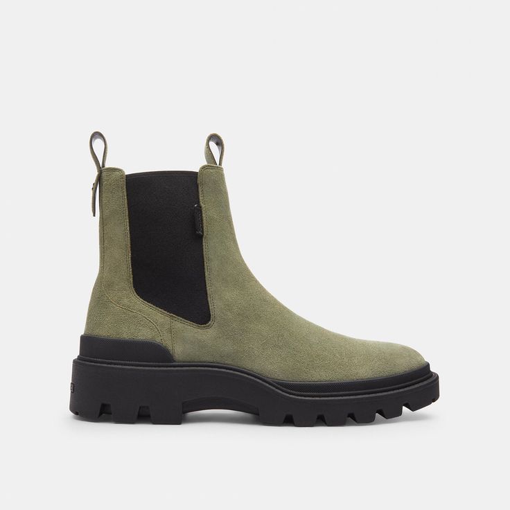 A rugged update on a classic Chelsea boot our Colson is crafted of velvety suede and sits on a durable chunky rubber lug sole. Featuring ribbed ankle gores and pull tabs for on-and-off ease it’s finished with our Signature hardware at the back for a heritage touch. | Coach Colson Boot Size 12 - Army Green Outdoor Boots With Lug Sole, Rugged High-top Moto Boots With Lug Sole, Ankle-high Hiking Boots With Lug Sole, Rugged Lace-up Hiking Boots With Lug Sole, Winter Hiking Boots With Lug Sole, Brown, Coach Boots, Signature Hardware, Lug Sole, Chelsea Boots