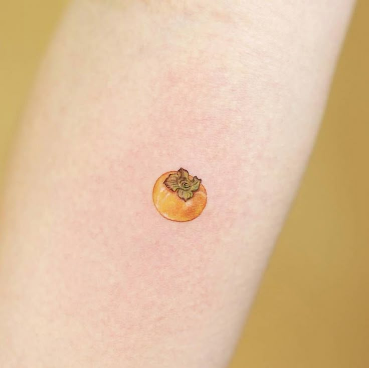 a close up of a person's arm with a small piece of food on it